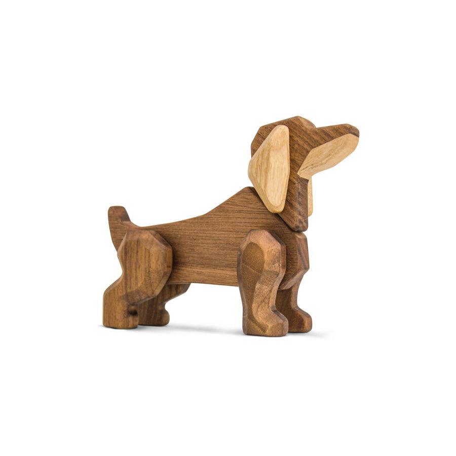 FableWood Dachshund stands in profile, made of light and dark wood, Model 1034-1.