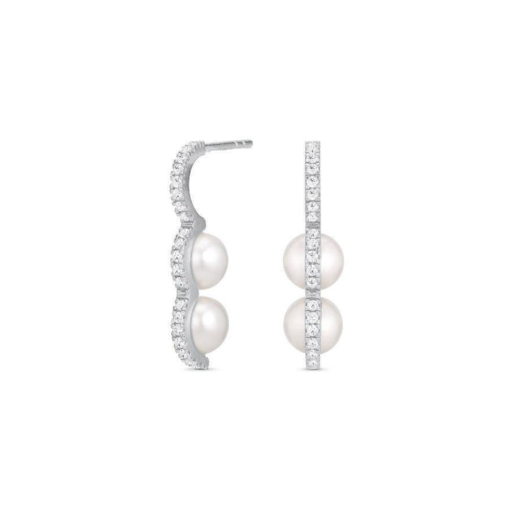 herieth-paul-x-polar-jewelry-bahati-solve-ring shows silver earrings with two white pearls and clear stones, Model bah-hs-sl-wp-wz-00502-1