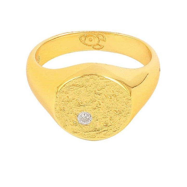 Hultquist Copenhagen Luna Ring S08116G shows a gold-tone ring with a round, matte surface and one clear stone. Model S08116G-002-1