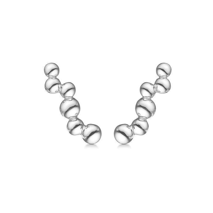 Mads Z silver earrings Embedded Ball shows two modern, curved silver earrings with a glossy surface. Model 2110084-1.