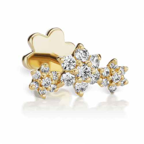 The Maria Tash Three Flower Garland Diamond Stud Earring 18K is shown in close-up with three flowers of white diamonds in a gold setting. Model xc3fld-002-1.