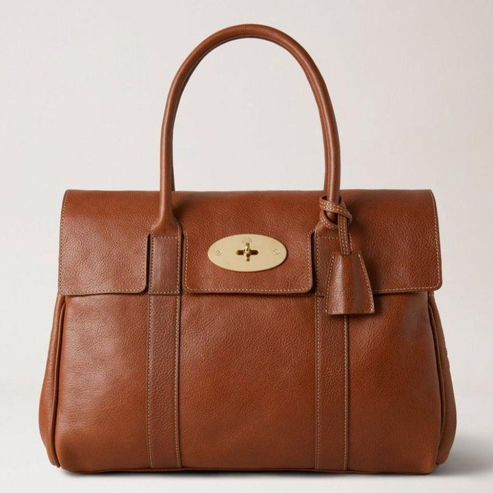 Mulberry Bag Bayswater Legacy NVT shows structured brown leather bag with classic gold buckle, Model HH7941275G110