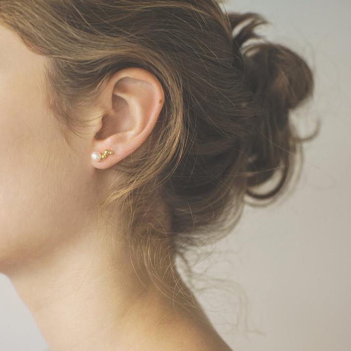 Polar Jewelry Bubble gold plated ear stud shown on ear, elegant pearl and gold detail. Model WP-00140-2