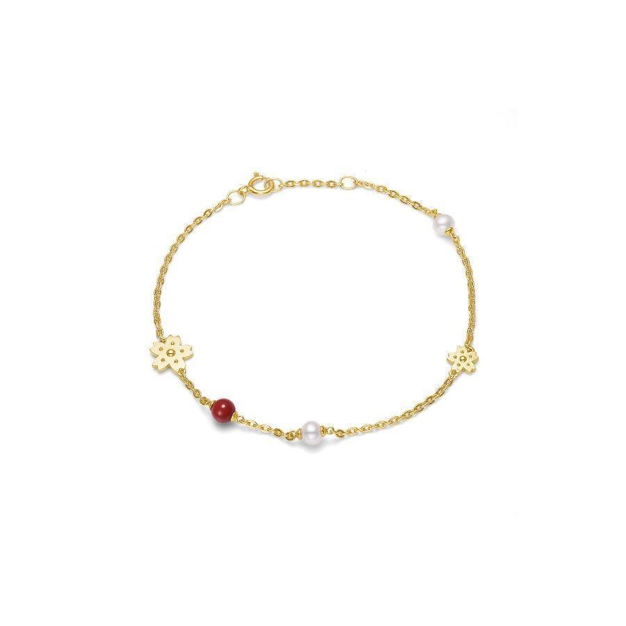 Polar Jewelry Sakura gold-plated bracelet with flowers, pearls and a red stone. Model case-br-gd-wp-rc-00133-1
