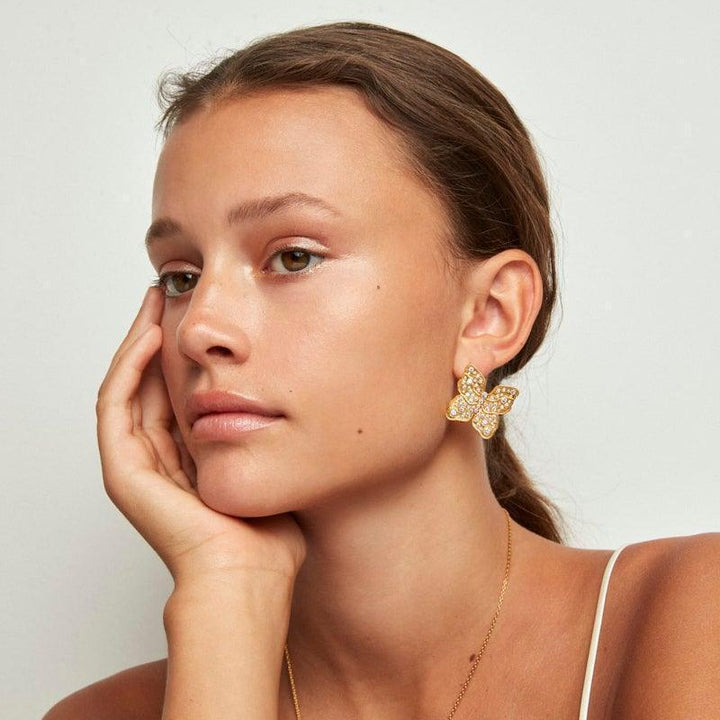Polar Jewelry The Butterfly gold-plated earring appears on the ear, large gold-colored butterfly with stones, Model TBU-ST-GD-WZ-00323