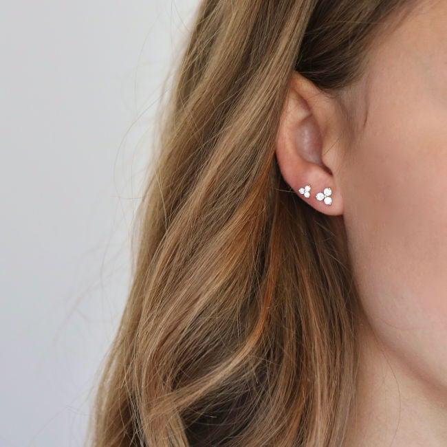 ro copenhagen 18kt fun diamond stud earrings are shown worn on the ear, elegant design in gold with small diamonds. Model 119280-2