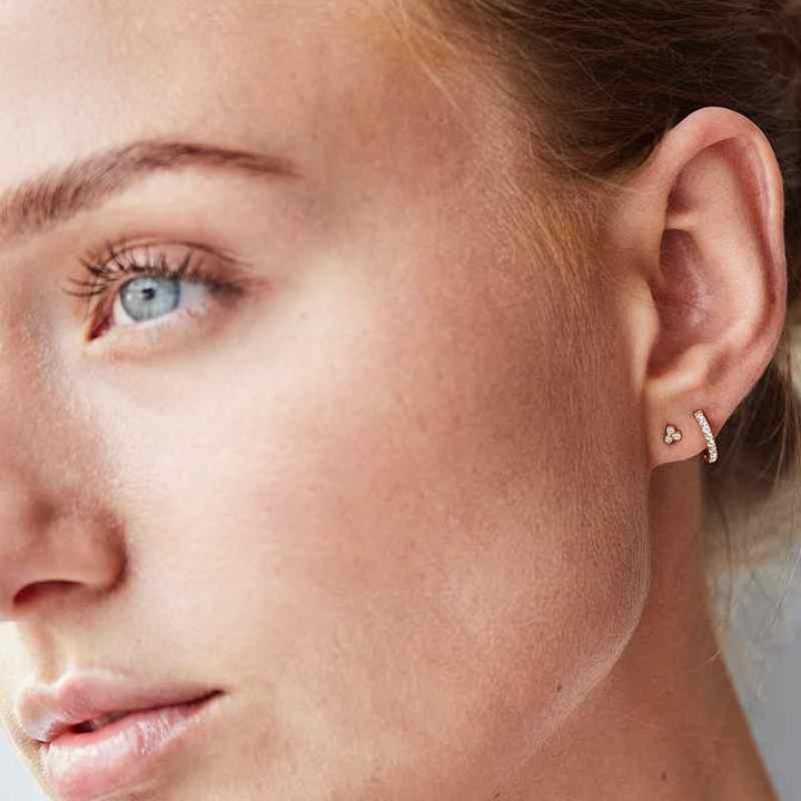 Ro Copenhagen 18kt Rock Classic 10mm Diamond Creole shown in the ear, elegant gold earring with diamonds. Model 119248-2